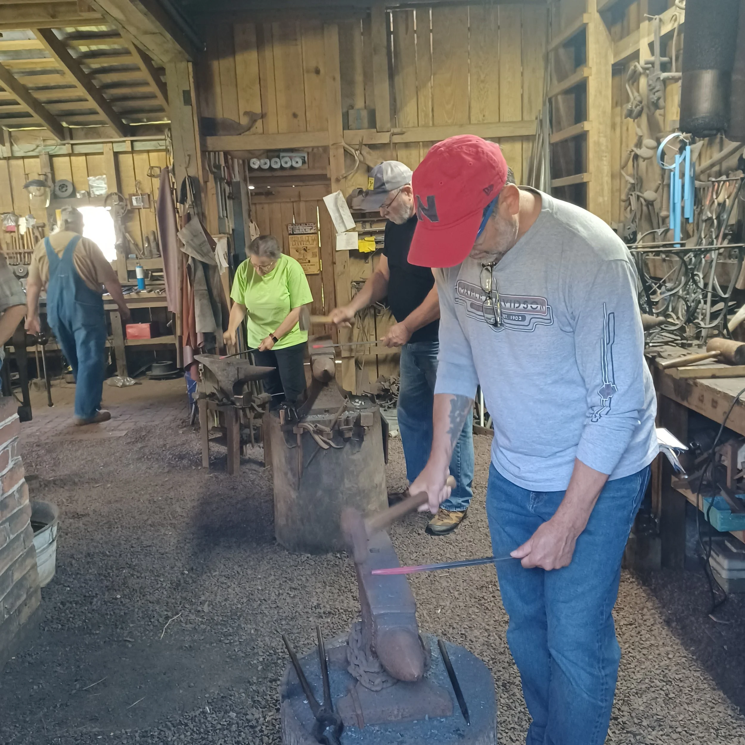Blacksmith 101 students pound hot metal (1).jpeg