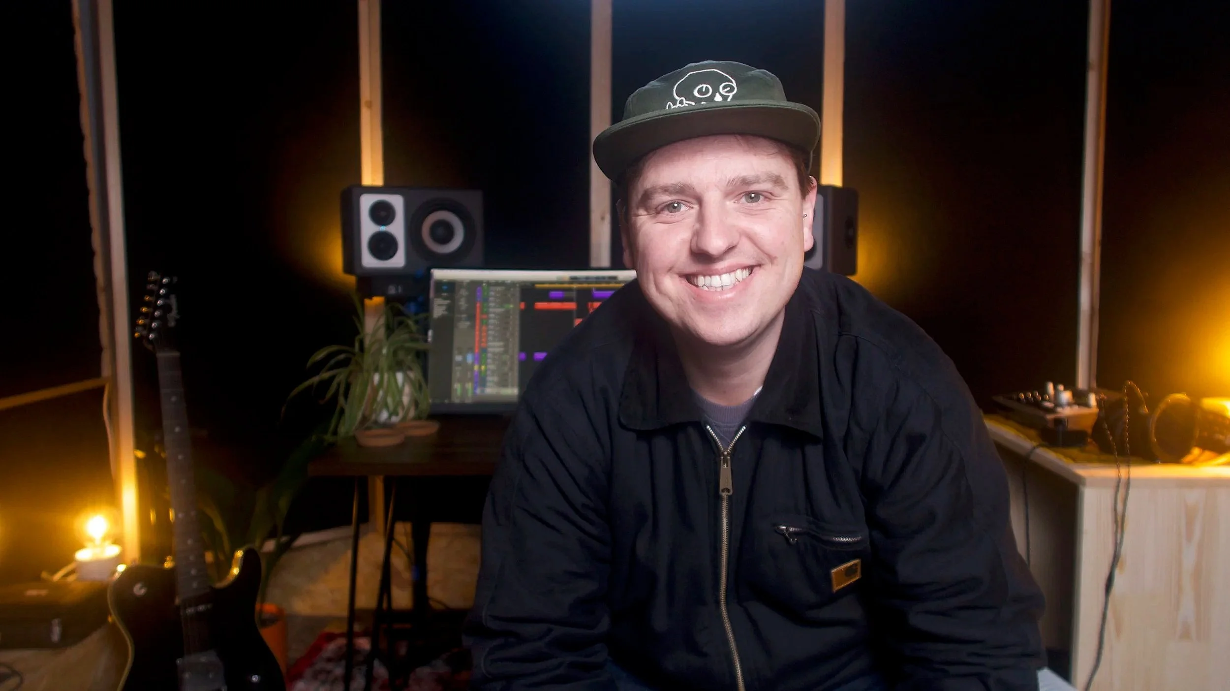 "Ed, founder of Framed Audio, smiling in his audio post-production studio in Leeds"