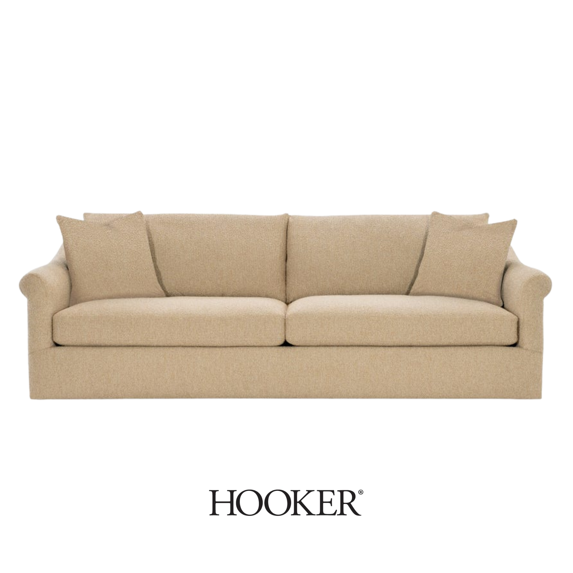 A beige upholstered sofa with several cushions handmade by Hooker Furnishings.