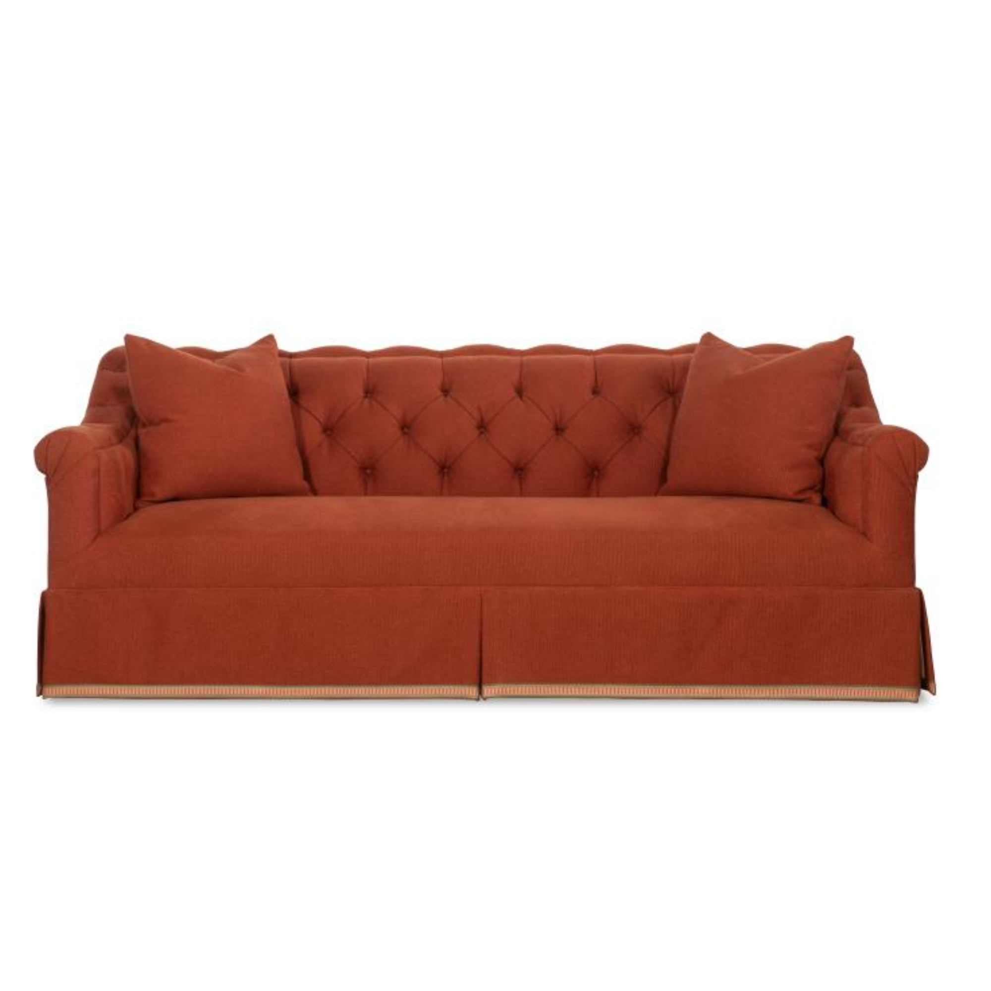 A red, tufted, fabric sofa from Highland House with matching pillows.