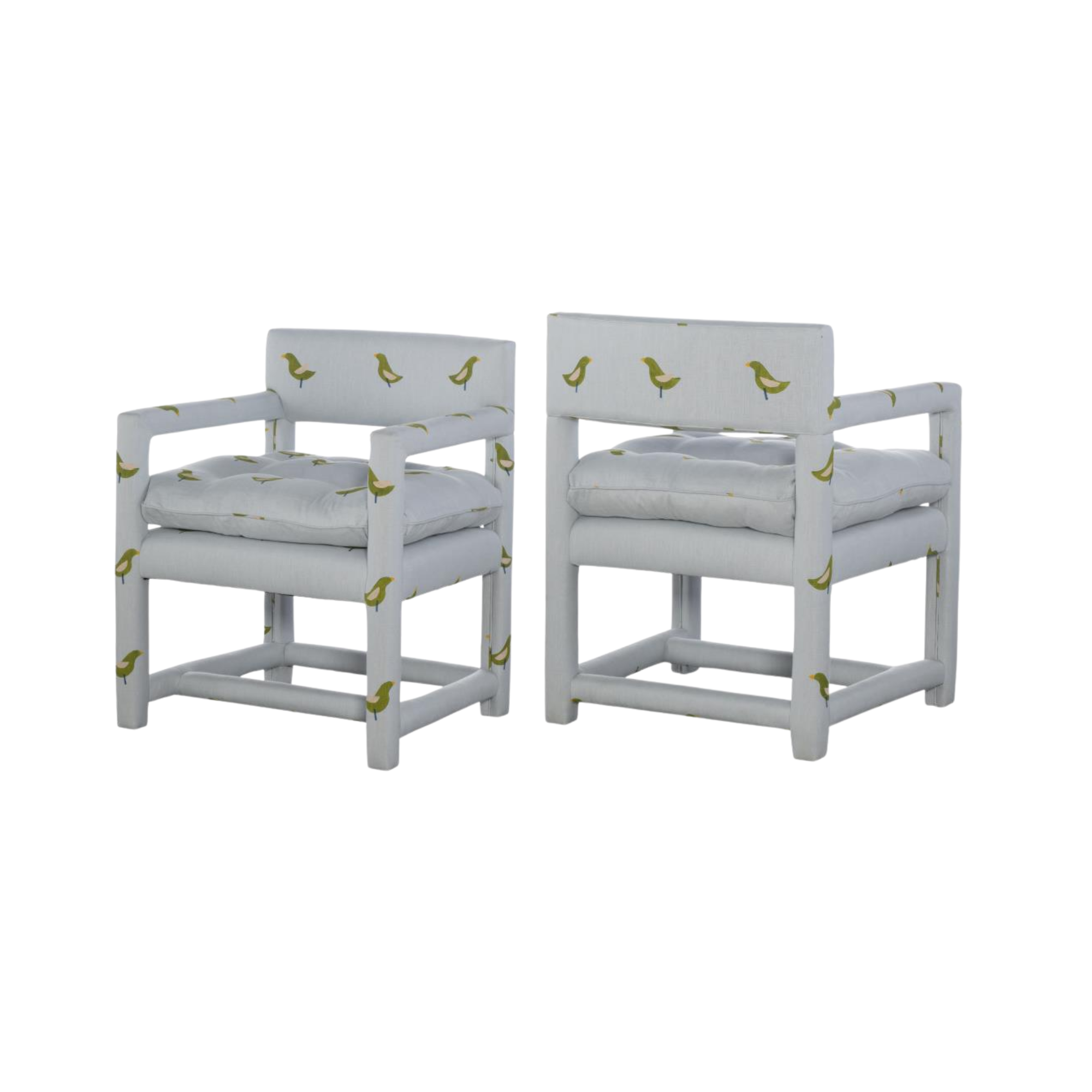 Two white chairs with yellow and green duck patterns, provided by Highland House.