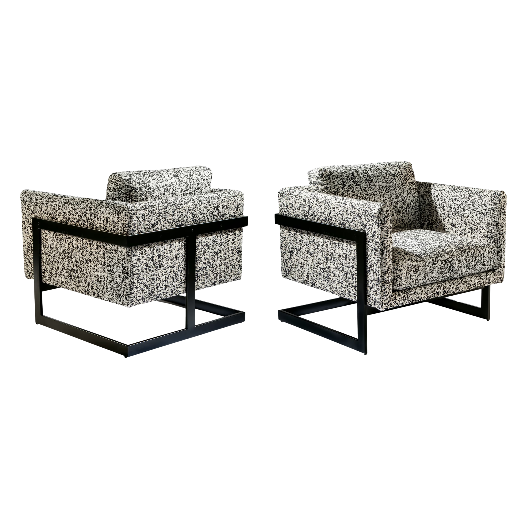 Two modern Thayer Coggin armchairs with black metal frames and patterned custom COM upholstery from Stout textiles.