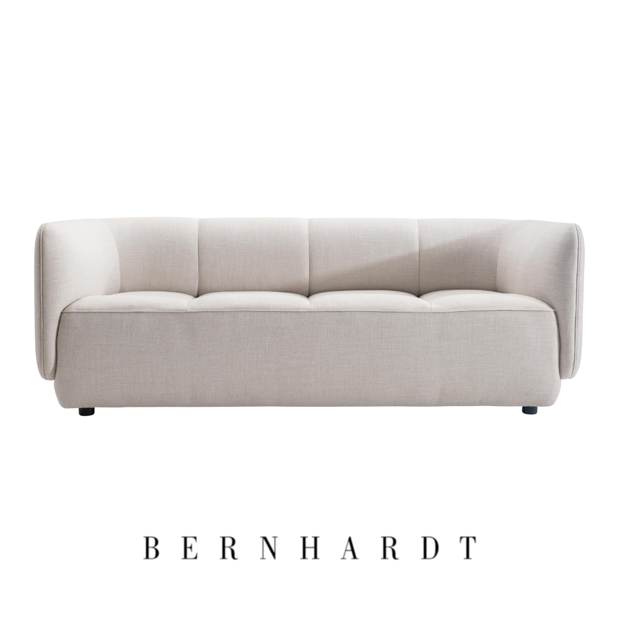 A white sofa from Bernhardt Interiors with black legs, centered on white background.