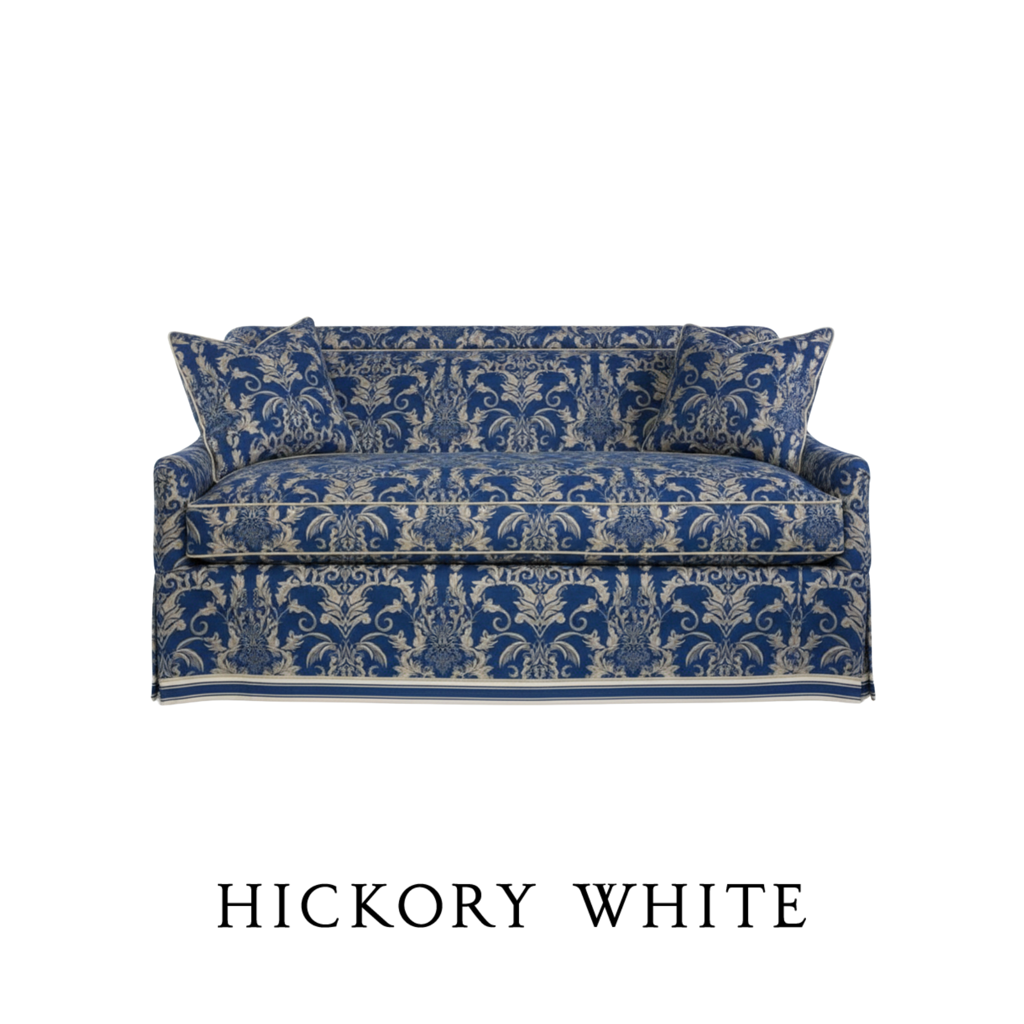 A blue and white patterned sofa with a floral design COM fabric and a matching pillow bespoke created by Hickory White.