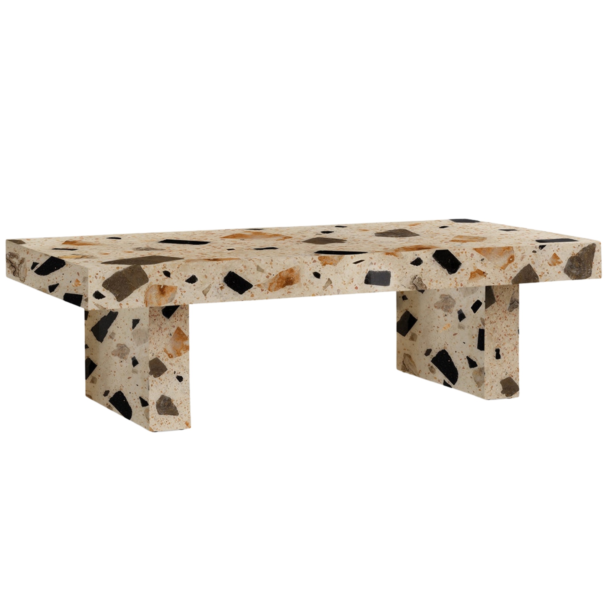 A terrazzo table with a thick, rectangular top and a single square leg, made of beige material with black, brown, and tan stone chips.