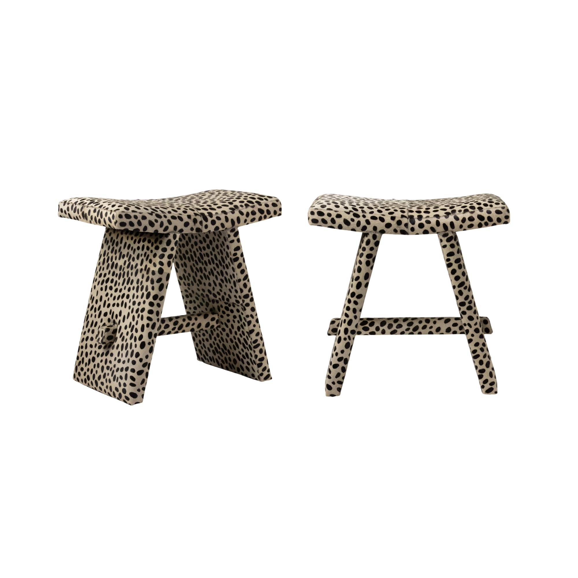 Two stools with black and white spotted upholstery, custom provided by made goods.