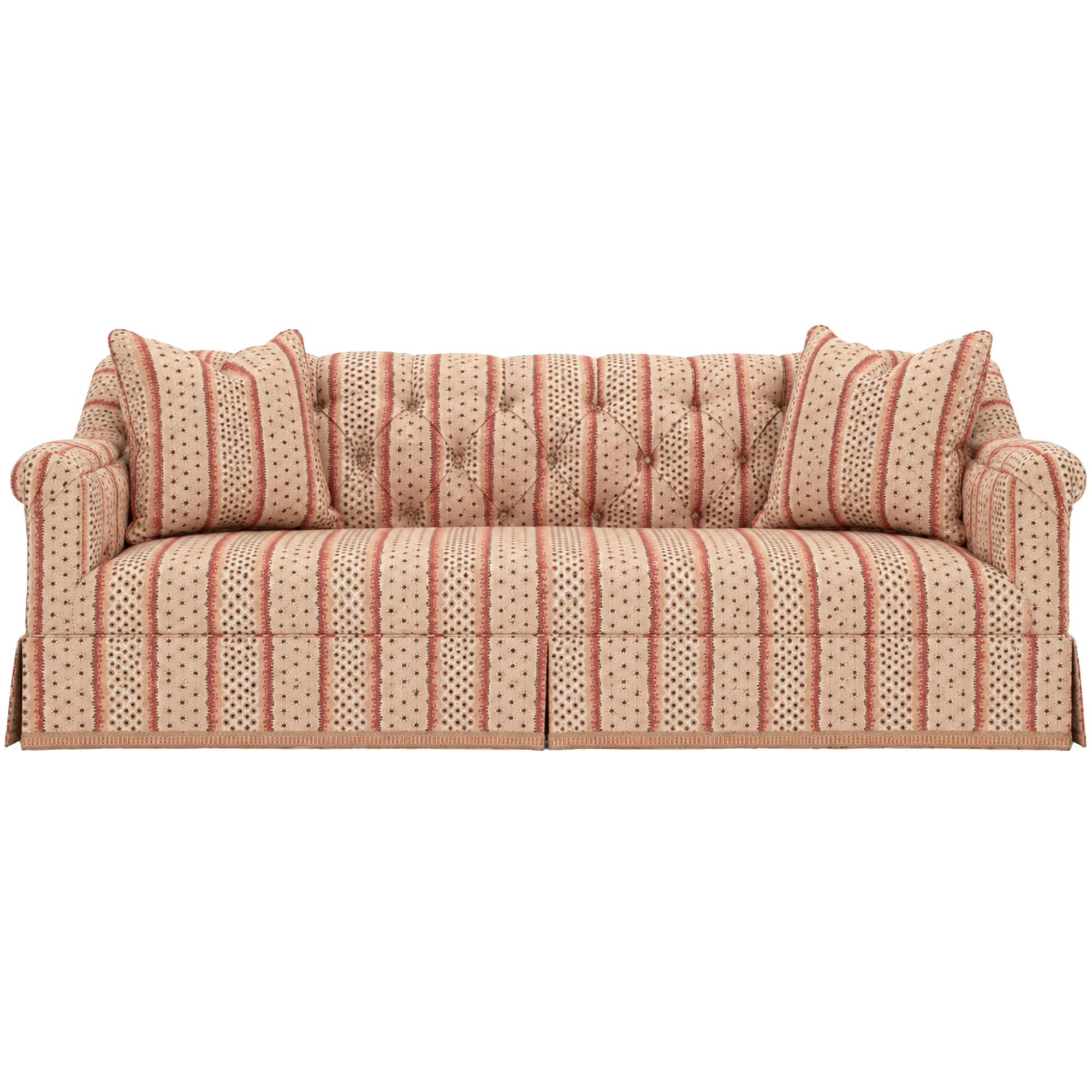 A vintage-style upholstered sofa with a matching Kerry Joyce fabric patterned pillow customized by Highland House.
