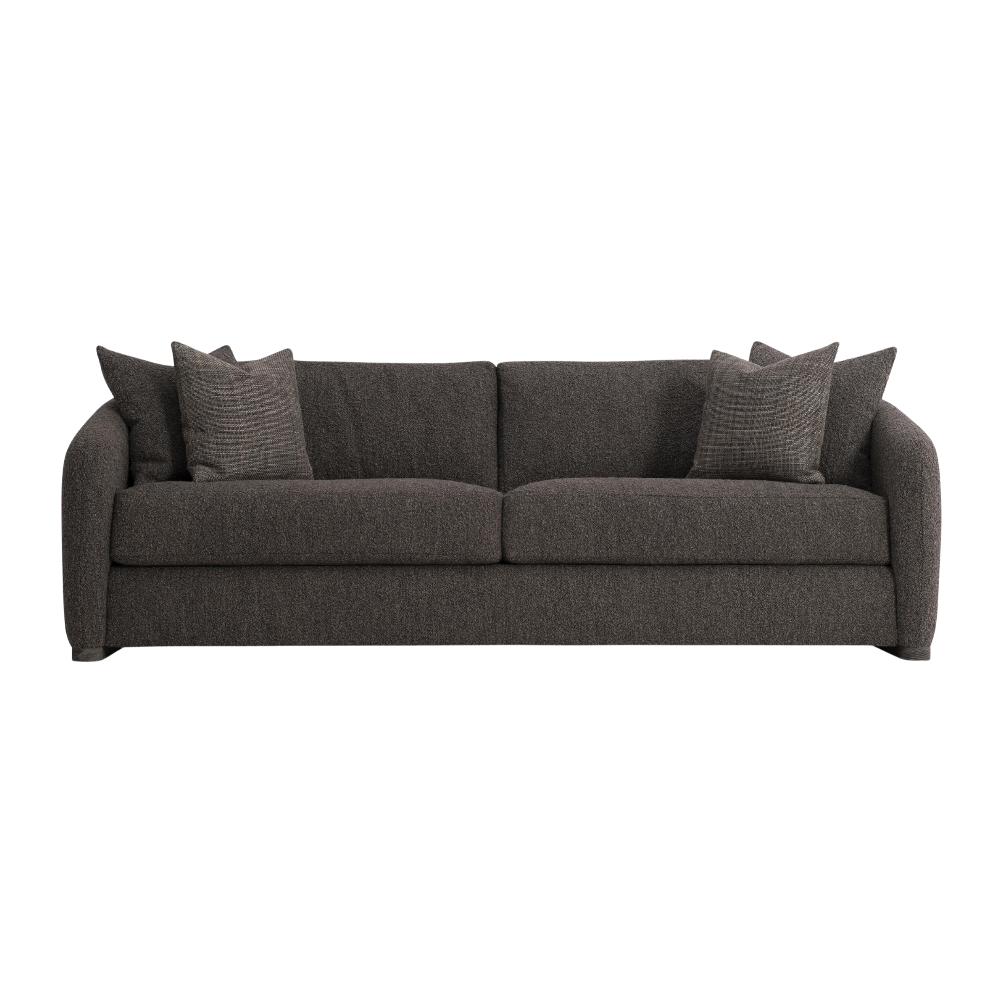 A dark gray sofa with multiple matching pillows with custom COM fabric from bernhardt furniture.