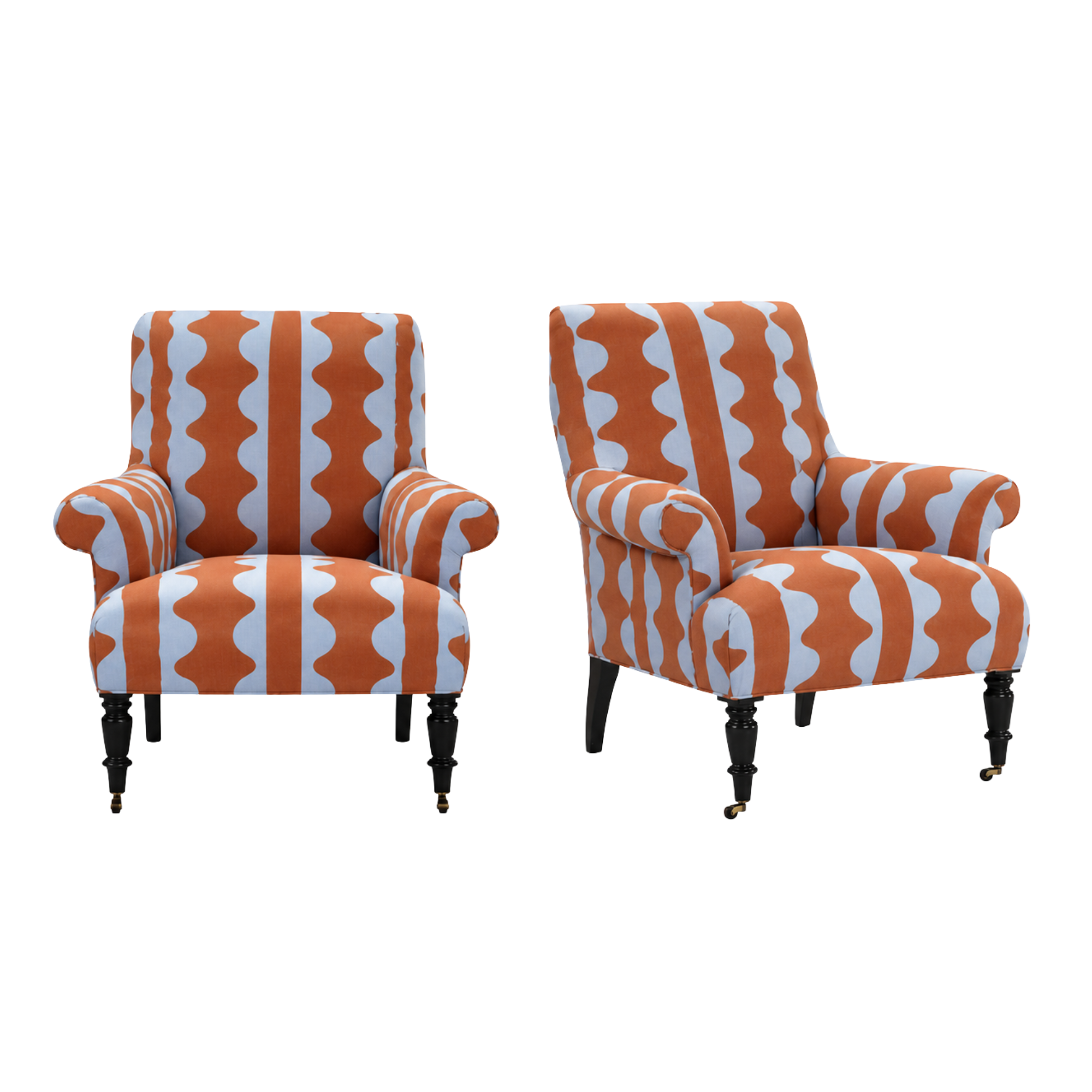 Two orange and white patterned armchairs from LEE Industries custom COM upholstered with JAB textiles fabric.
