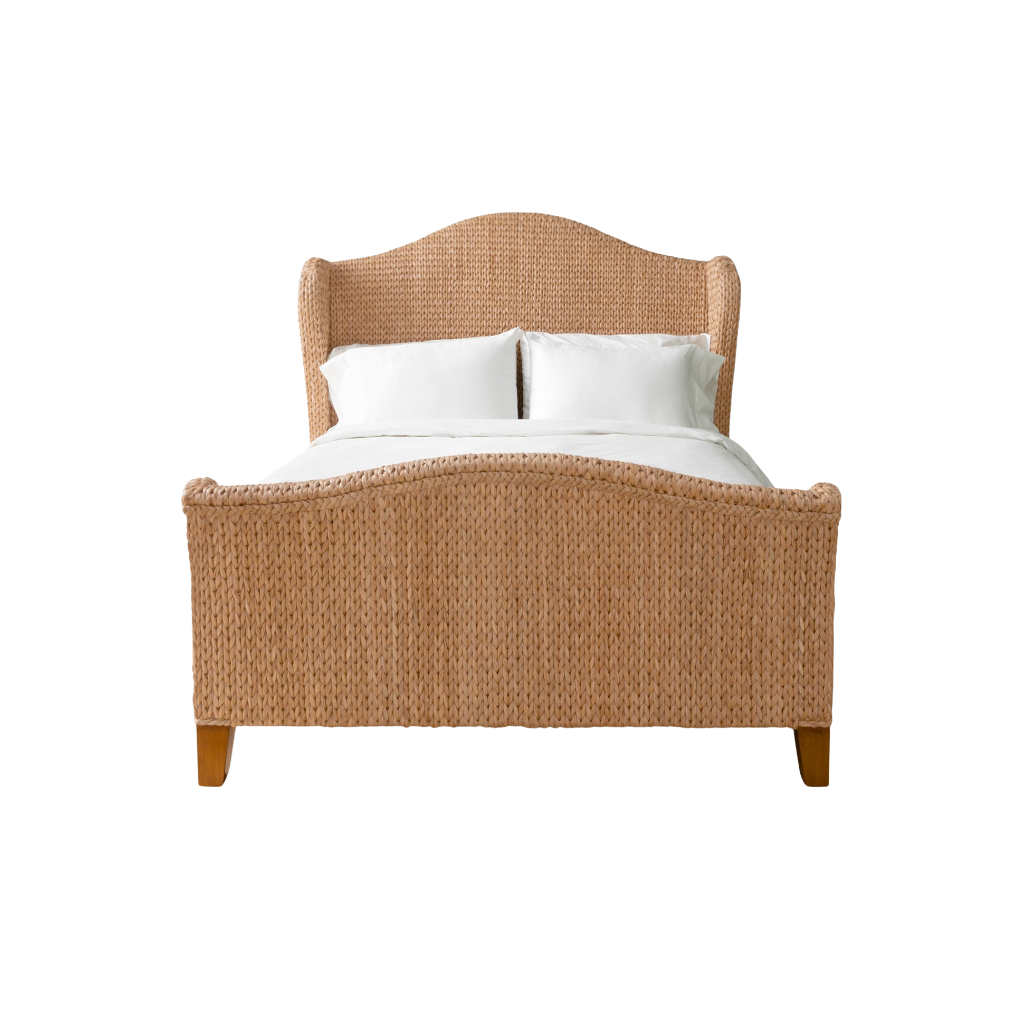 A wooden bed with a woven rattan headboard, white pillows, and white bedsheets created by made goods furniture brand.