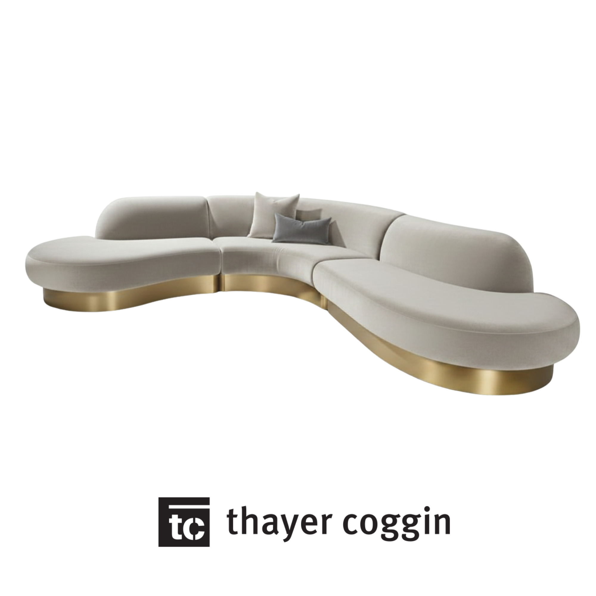 Modern white sectional sofa from Thayer Coggin with gray and beige pillows.