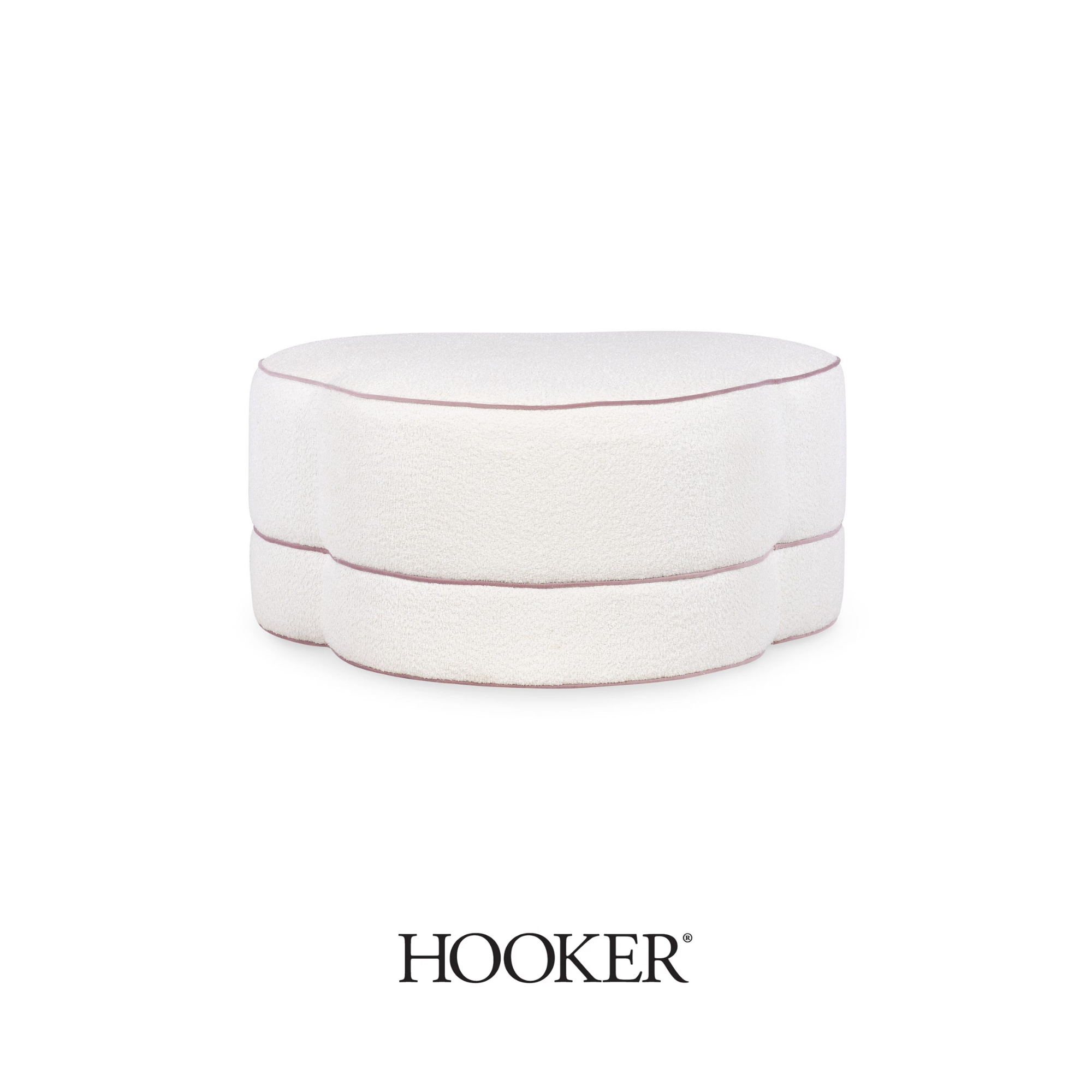 A white, round, upholstered ottoman from Hooker Furnishingd with light pink trim around its edge, placed against a white background.