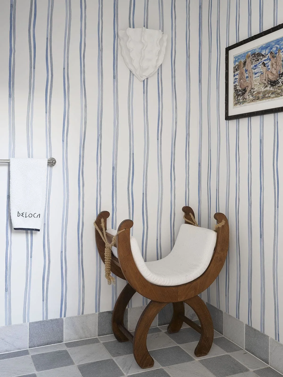  On to the bathrooms - I  die . The checkered tile, the amazing vintage sconces that feel reminiscent of undulating sea creatures. They all tell such an interesting story yet seamlessly flow together. I love the sculptural sconces - they remind me of
