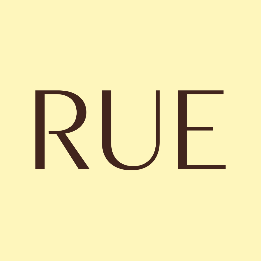 Part of a logo or sign with a light yellow background and dark brown text that reads 'rue magazine' and 'view'. The image is cropped, showing only a section of the full design.