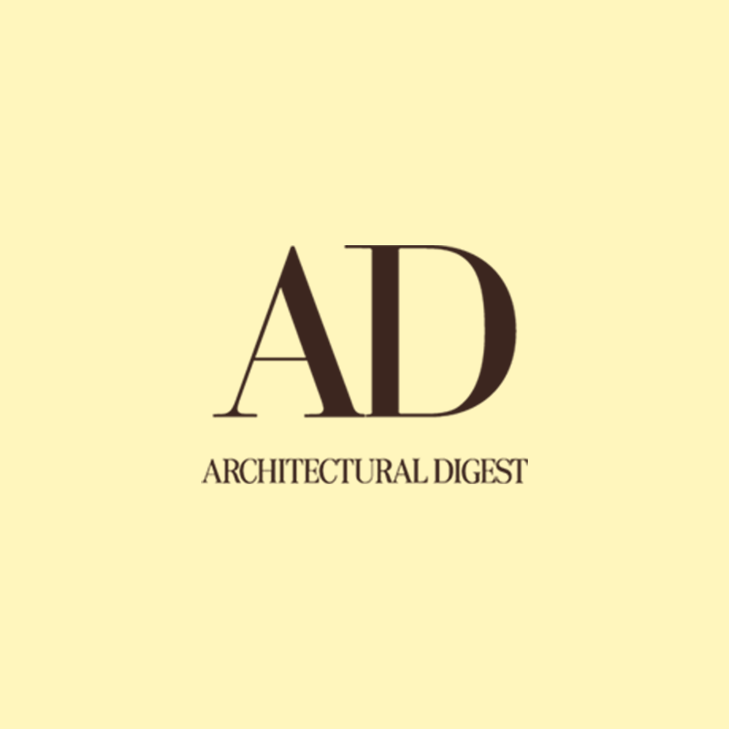 A close-up of publication cover titled 'Architectural Digest' with black text on a light yellow background.