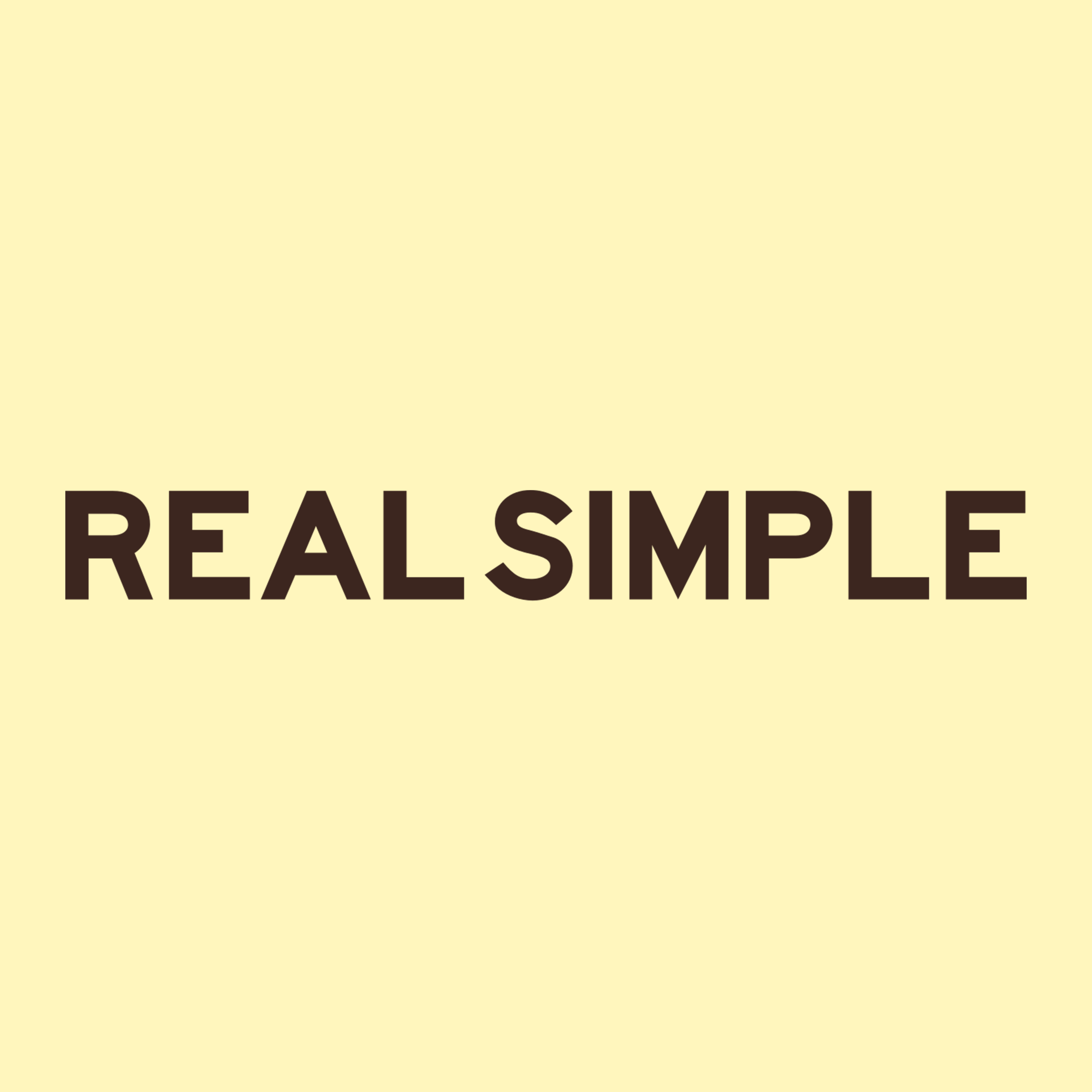 Close-up of a beige background with black text that reads 'REAL SIMPLE.'