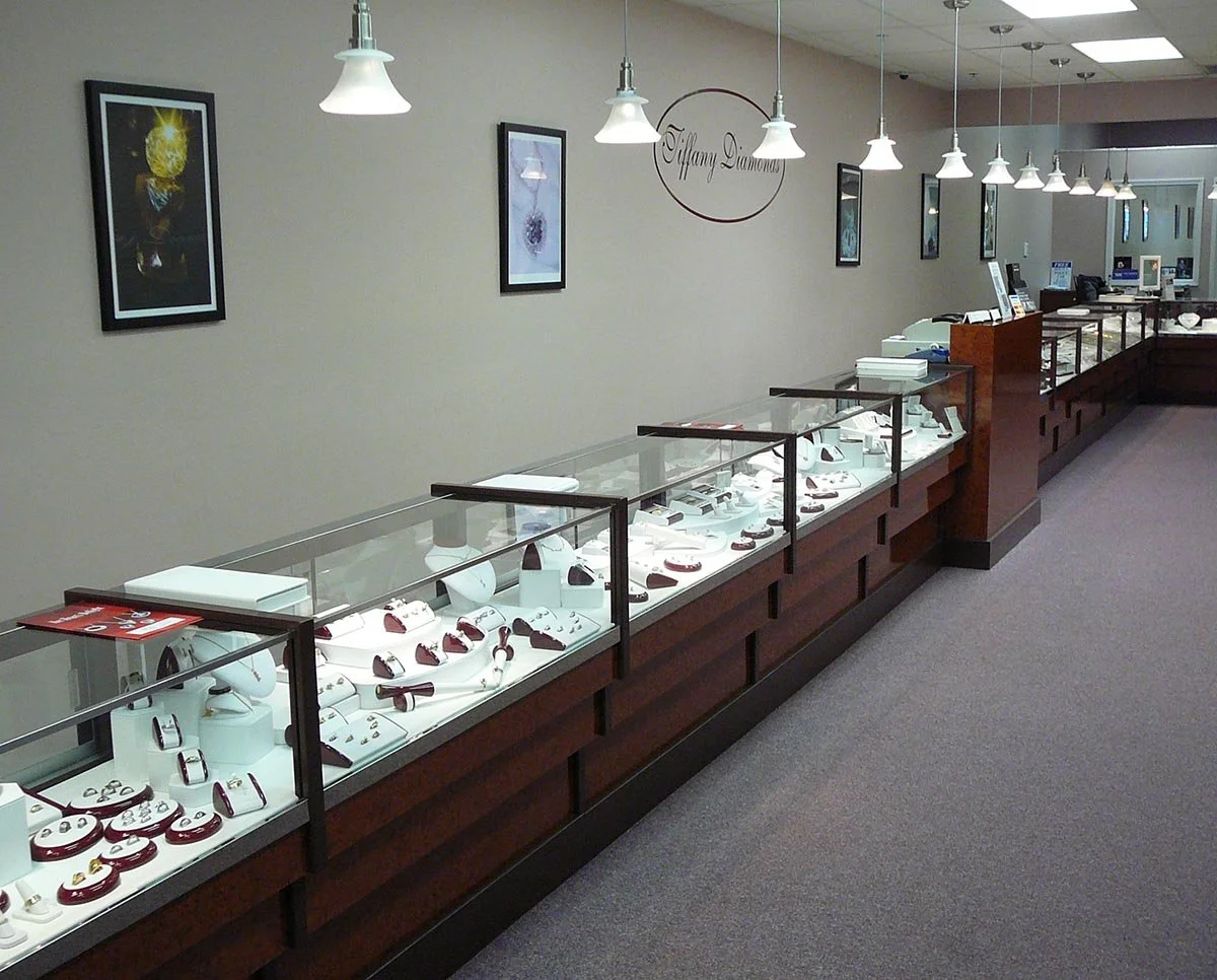 Complete interior renovation of a jewelry store.  Work included: re-laminating and new laminated glass on all the existing showcases, new wall and trim paint, carpet, signage.  Tiffany Diamonds, Wyandotte, MI.