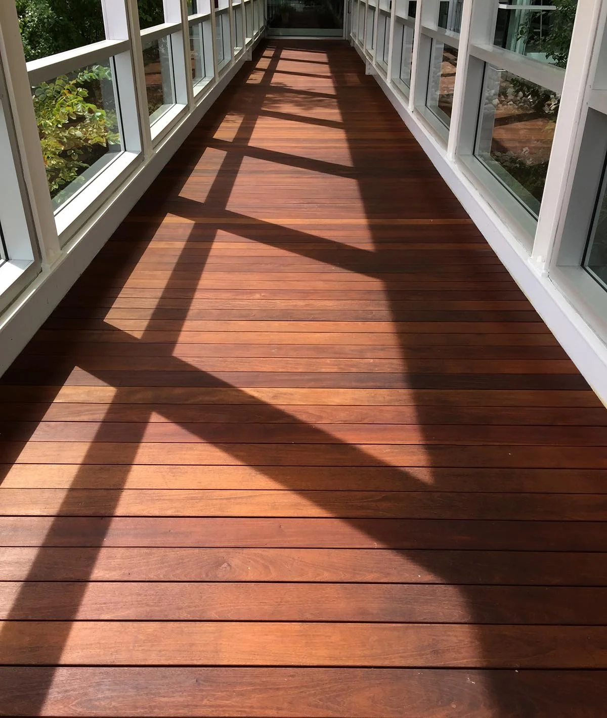 Installation of 700 sq ft of Brazilian Walnut Ipe (exotic wood) decking. Mahle Industries, Troy, MI.
