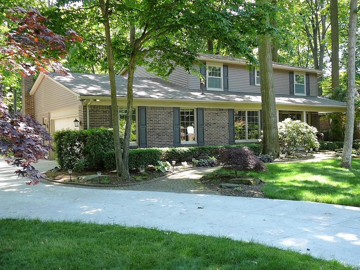 Complete interior and exterior renovation.  Exterior work included: new Andersen windows, new vinyl siding and trim, new roofing, new concrete driveway.  Breza Drive, Shelby Township, MI.