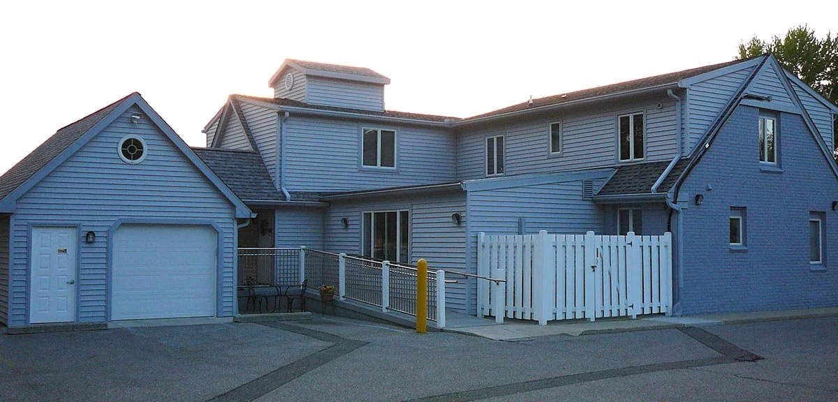 Buckles and Buckles rear elevation.  Work completed included new addition, new detached garage, new ADA compliant ramp, new water retention system with catch basins, new parking lot, etc.