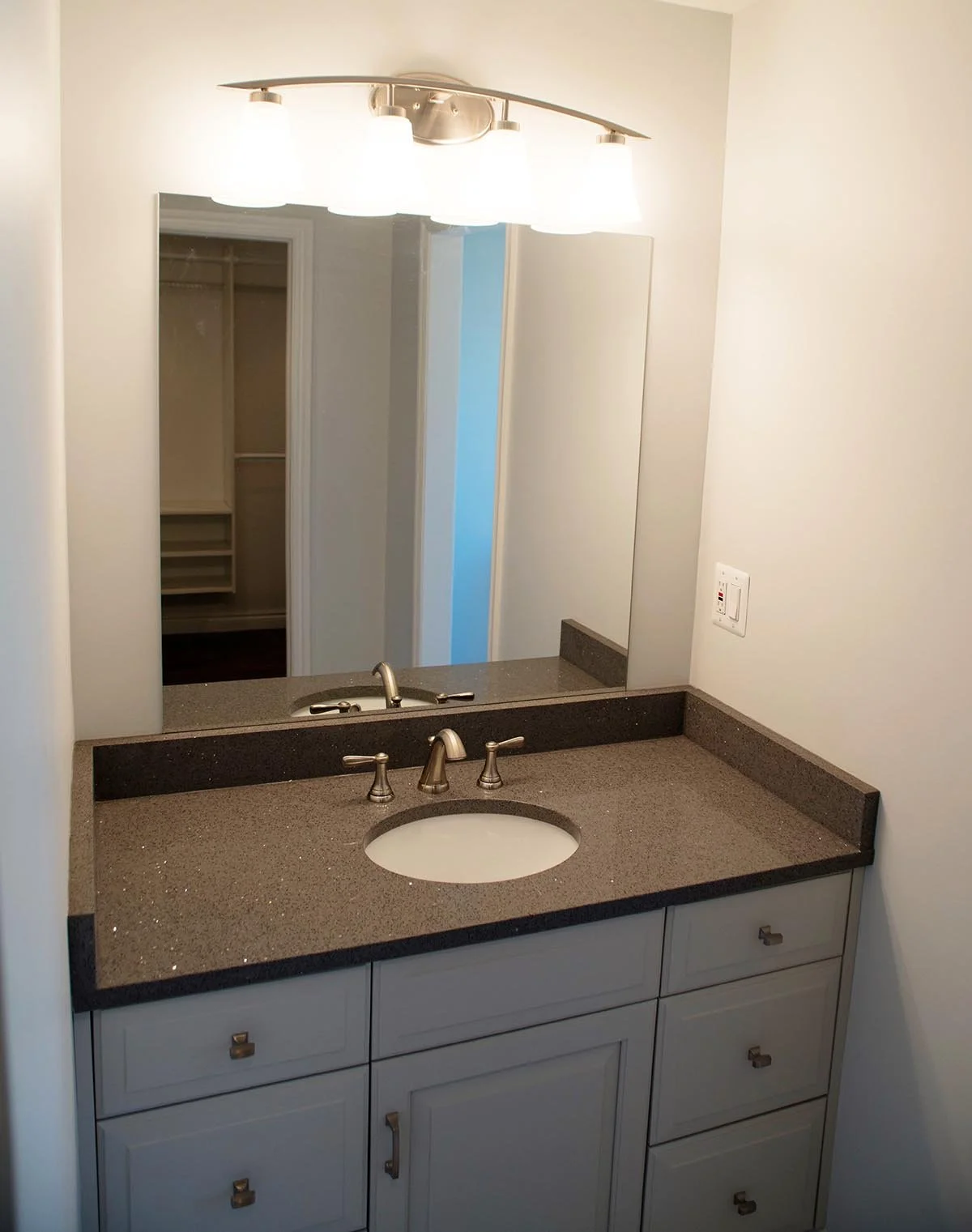 Breza bathrooms included: new LaFata cabinets and quartz tops, etc.