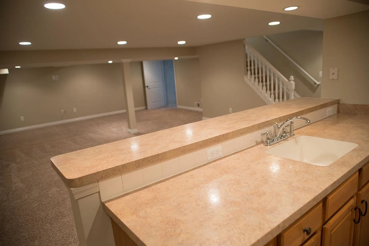 Breza basement included: new kitchen and bathroom, new recessed L.E.D. lighting throughout, new drywall, new doors and trim, new paint and carpeting.