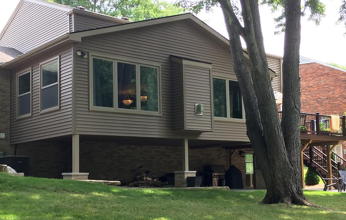 Shady Hollow rear elevation included: new 450 sq ft elevated addition, new elevated Trex decking and railing.