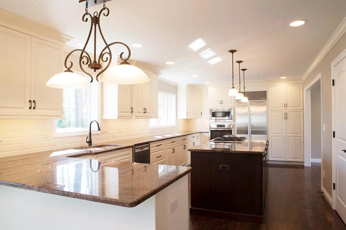 Breza kitchen elevation included: new hardwood floors, new LaFata cabinets and granite tops, new plumbing and electrical fixtures, new stainless steel appliances, new doors and trim, paint, etc.