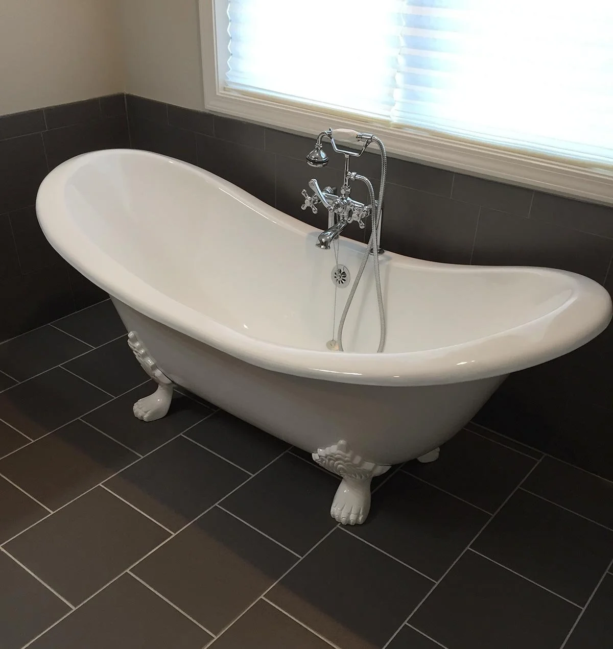Old North River master bath work included: porcelain floor and wall tile, free standing cast iron tub with chrome tub fill.