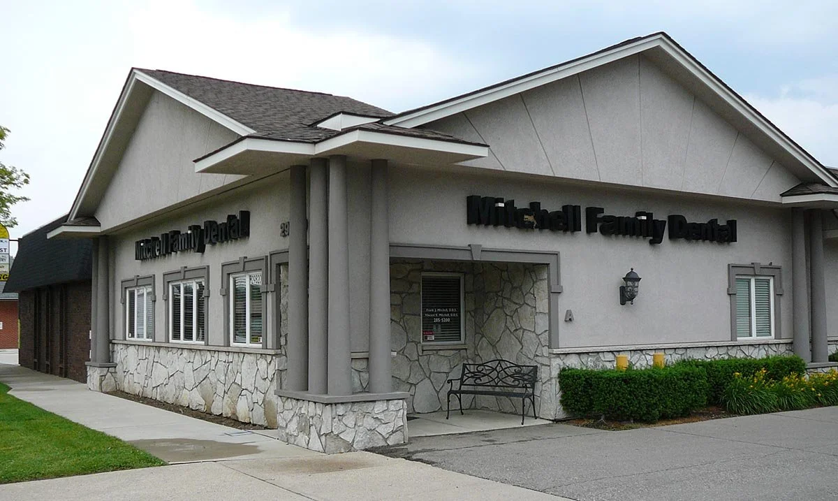 Converted a 5000 sq ft hardware store into a state of the art dental practice.  Complete exterior work included: framing, new doors and windows, custom stone work, Dryvit, signage, asphalt parking lot, landscaping, etc..  Mitchell Dental, Saint Clair