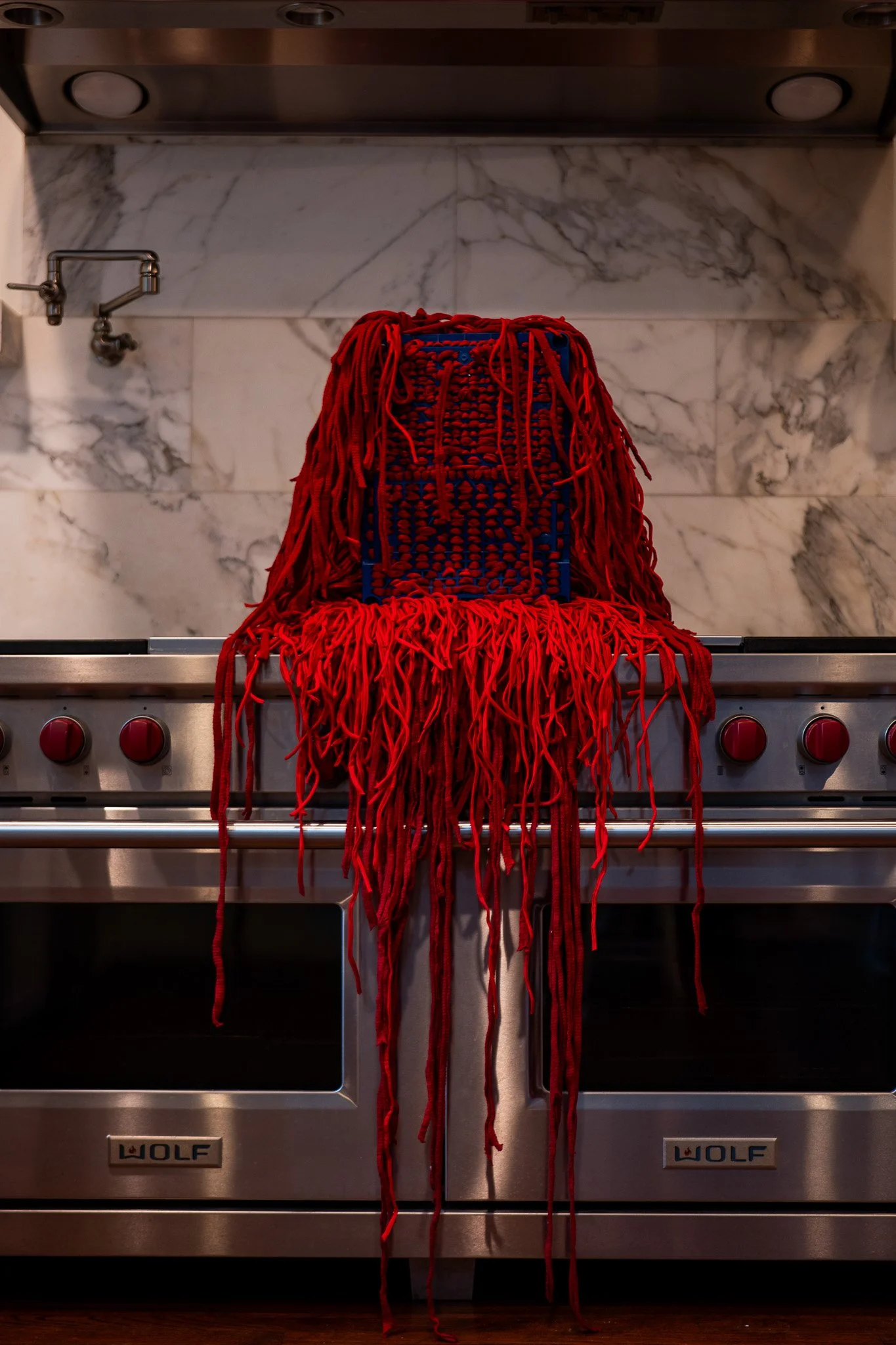 Untitled, 2023. Found object and red cotton thread - 