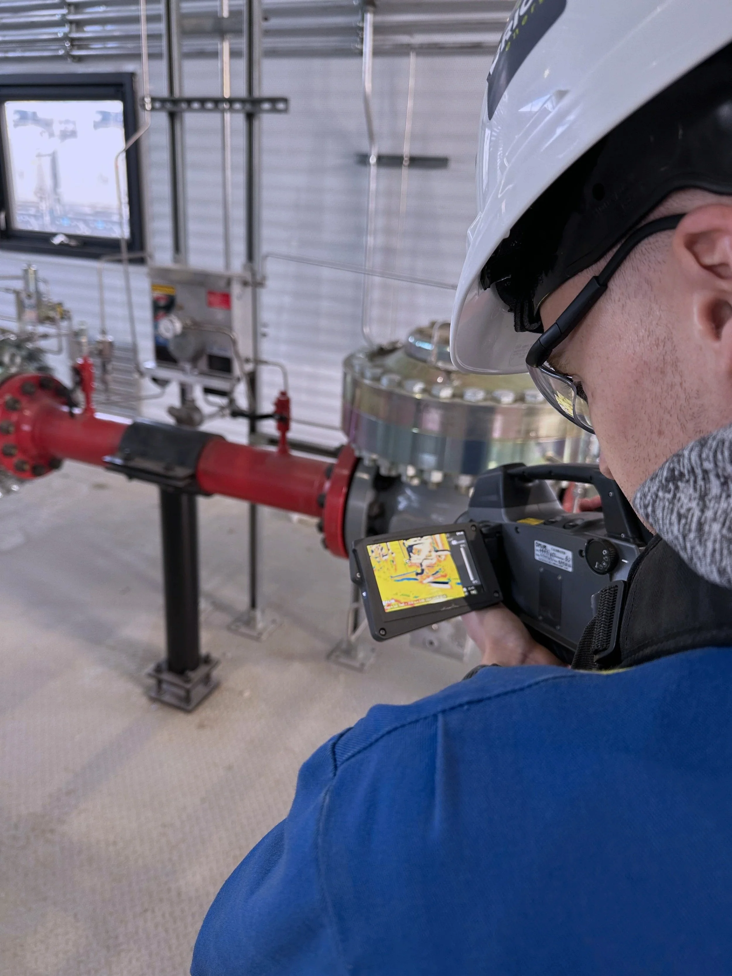 Research Associate scans pipes and equipment for methane leaks