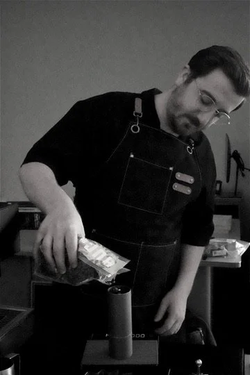 Little Coffee Co barista grinding coffee for handcrafted pour-over service in Madison, WI and surrounding areas