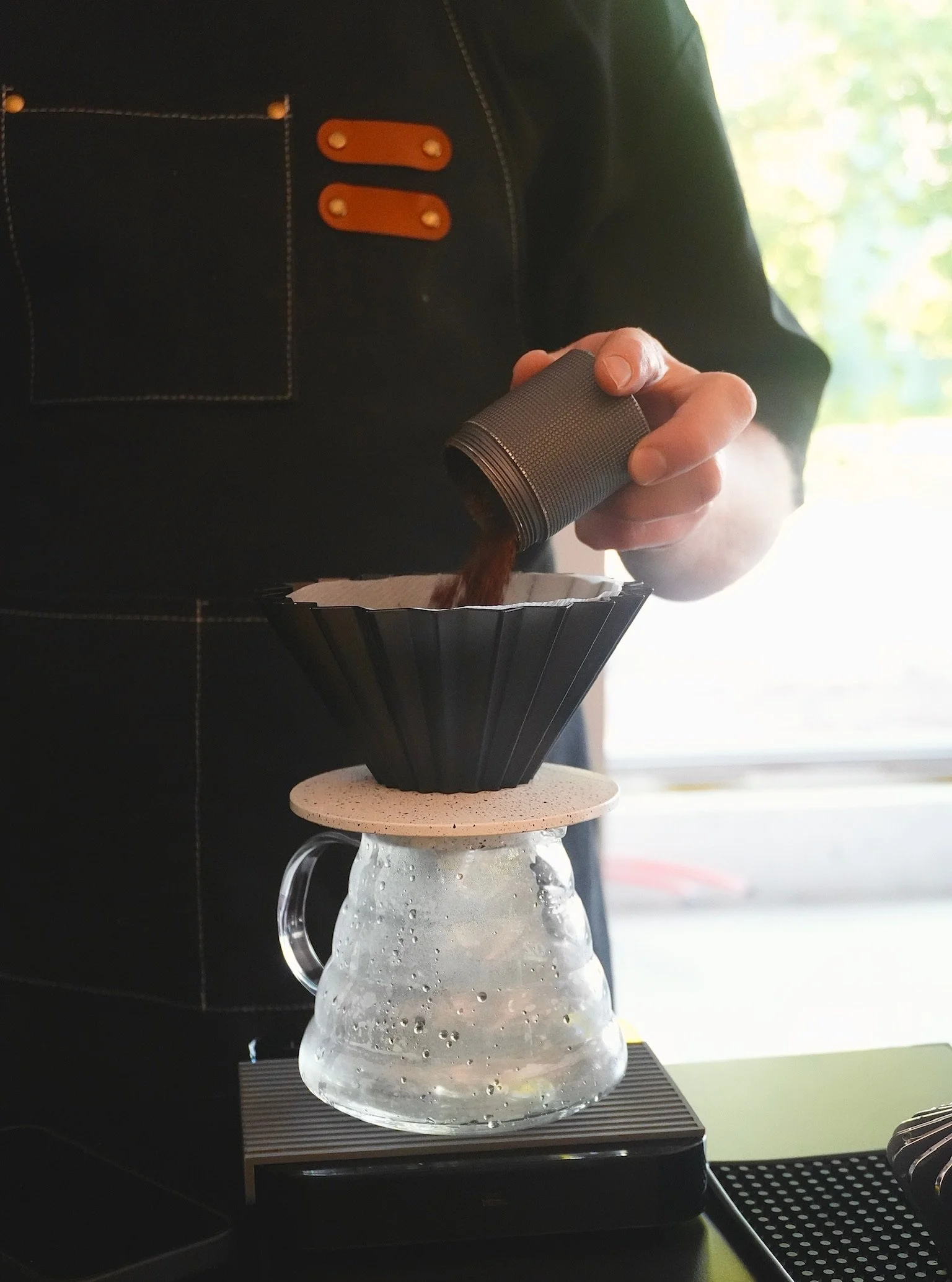 Barista preparing pour-over coffee for Little Coffee Co coffee catering in Madison, WI and surrounding areas.2