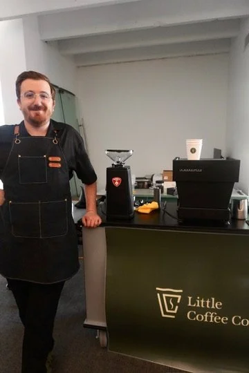 Batu, founder of Little Coffee Co, preparing coffee service for events in Madison, WI and surrounding areas