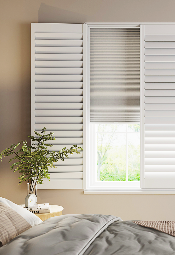 Patoma white Faux Wood Lite composite full height window shutters in a contemporary bedroom, featuring waterproof construction and adjustable louvres for privacy, natural light control and a clean modern finish.