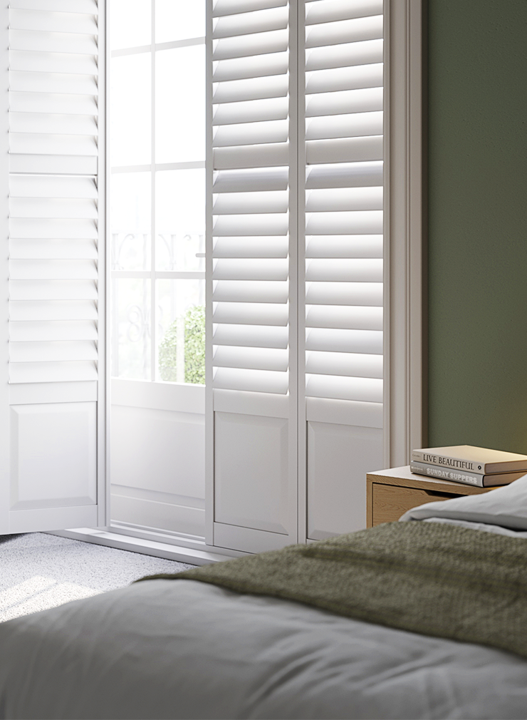 Close-up of Patoma white composite full height window shutters in a contemporary bedroom, featuring waterproof construction and adjustable louvres for privacy and natural light control.