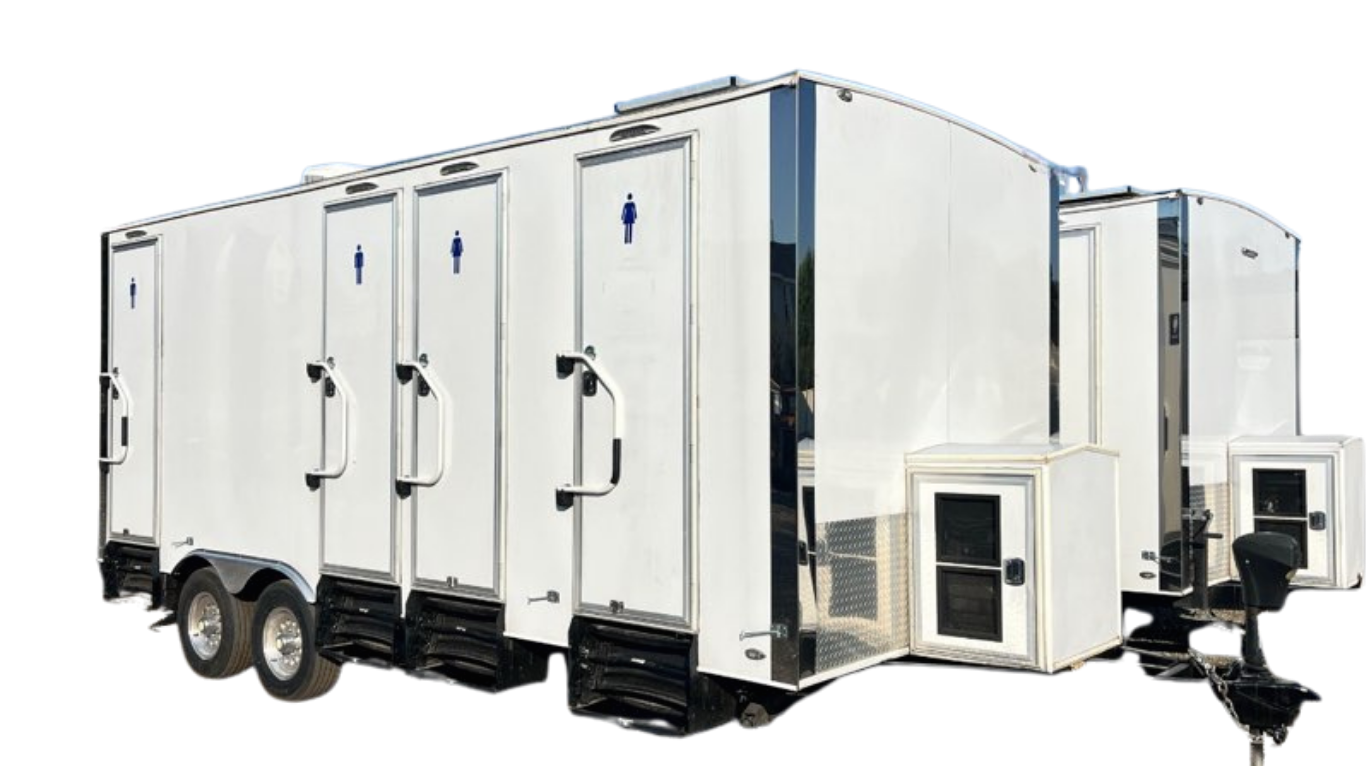 White mobile restroom trailer with multiple doors, each marked with a blue restroom symbol, equipped with steps, wheels, and a hitch for towing.