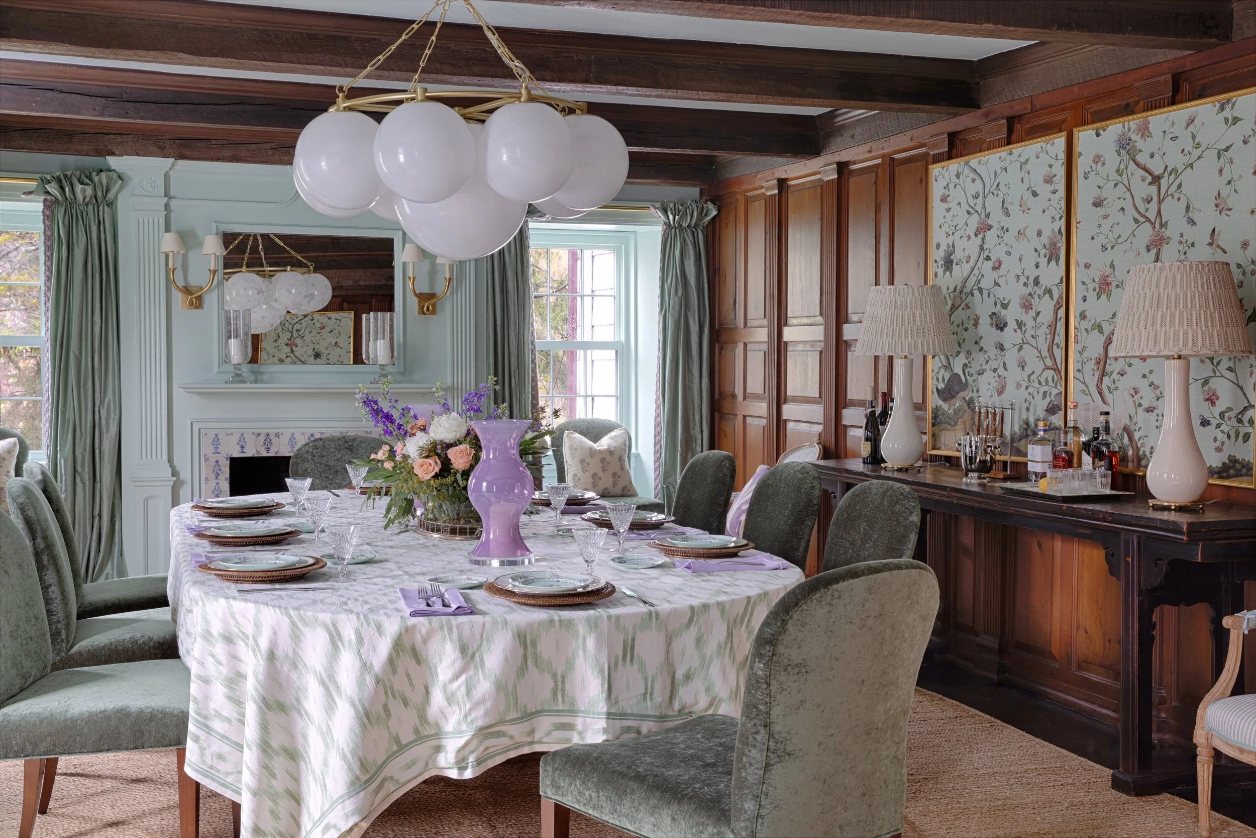 Dining room with original paneling and beams in a 1783 Long Island farmhouse by Amal Kapen