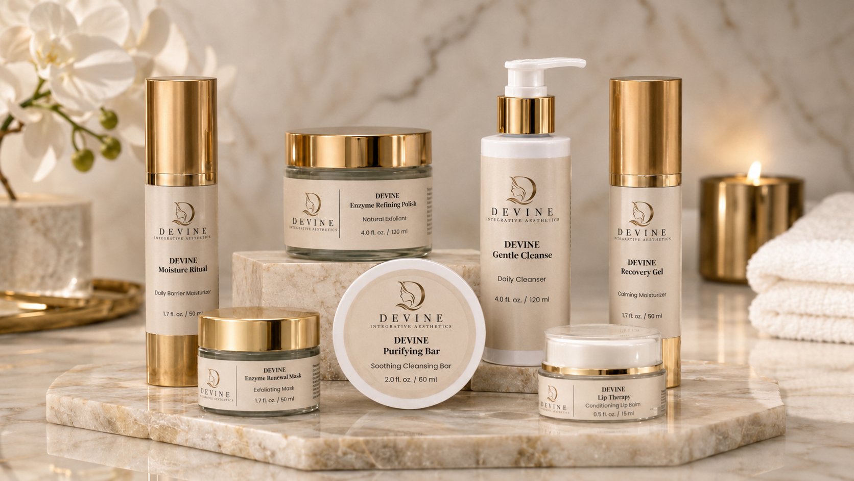 arranged skincare products including cleansing foam, exfoliant, moisturizer, lip balm, and cleansing bar on a marble surface with flowers and candles in the background