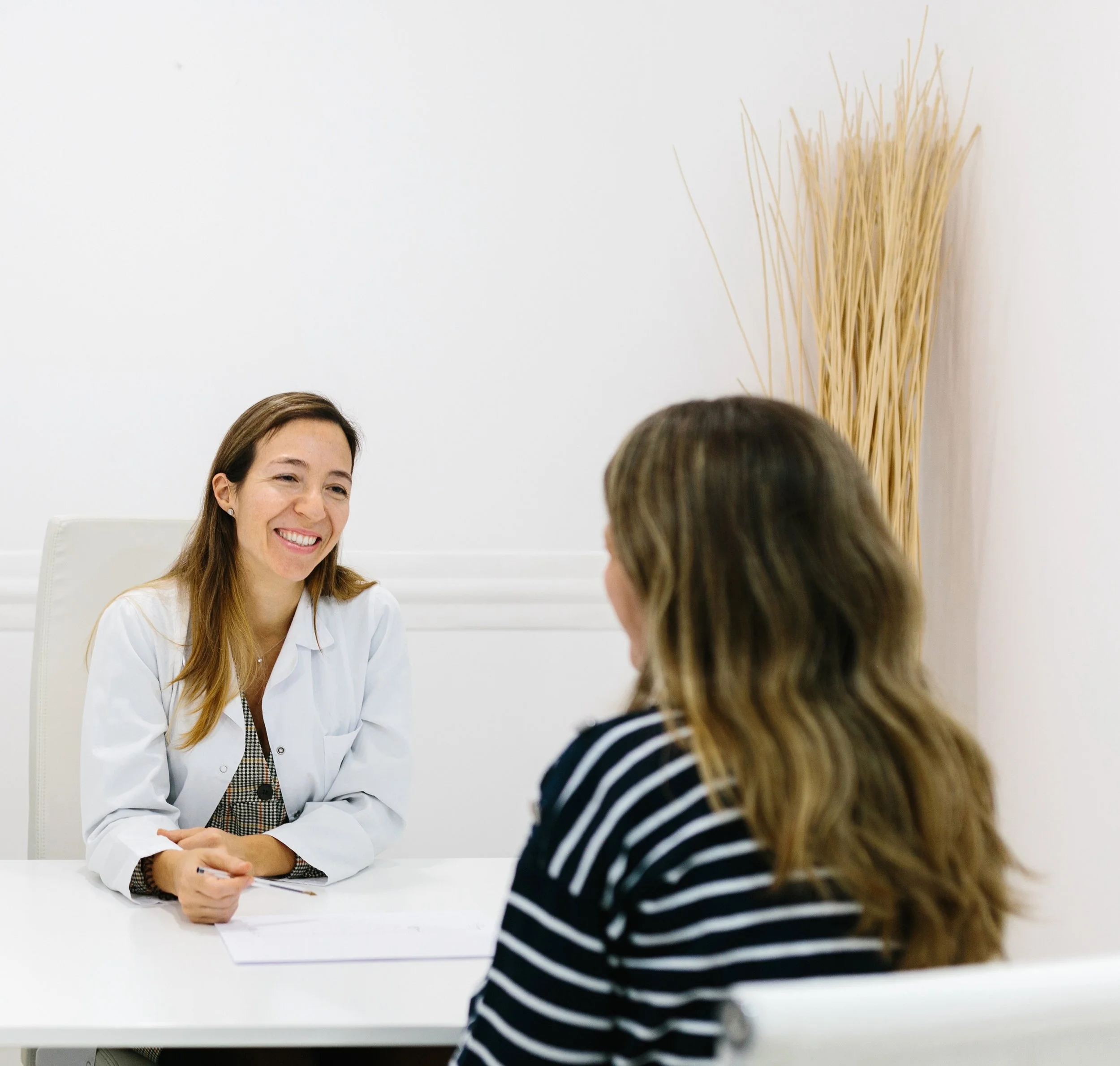 A medical professional consulting with a patient.