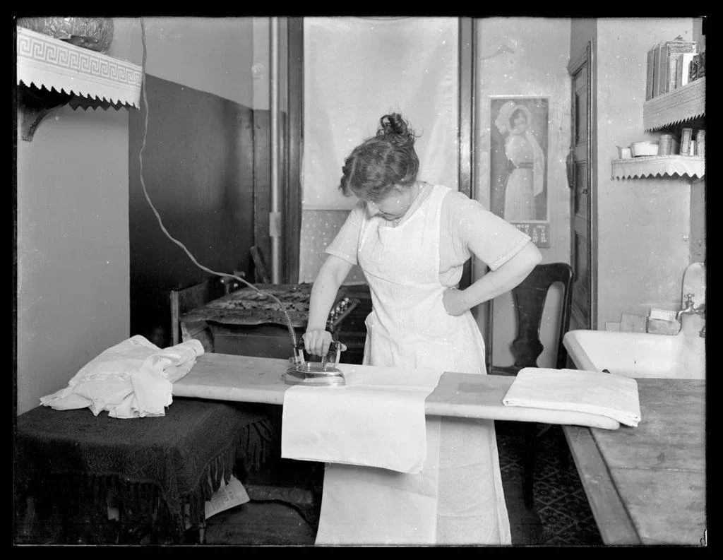 Unidentified woman ironing ca. 1910