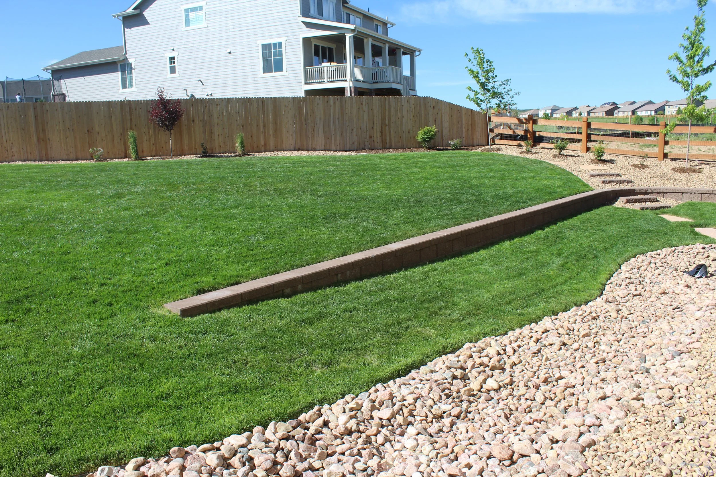 Parker back yard sod and retaining wall