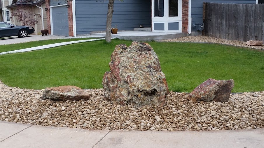 Littleton front yard moss rock boulders