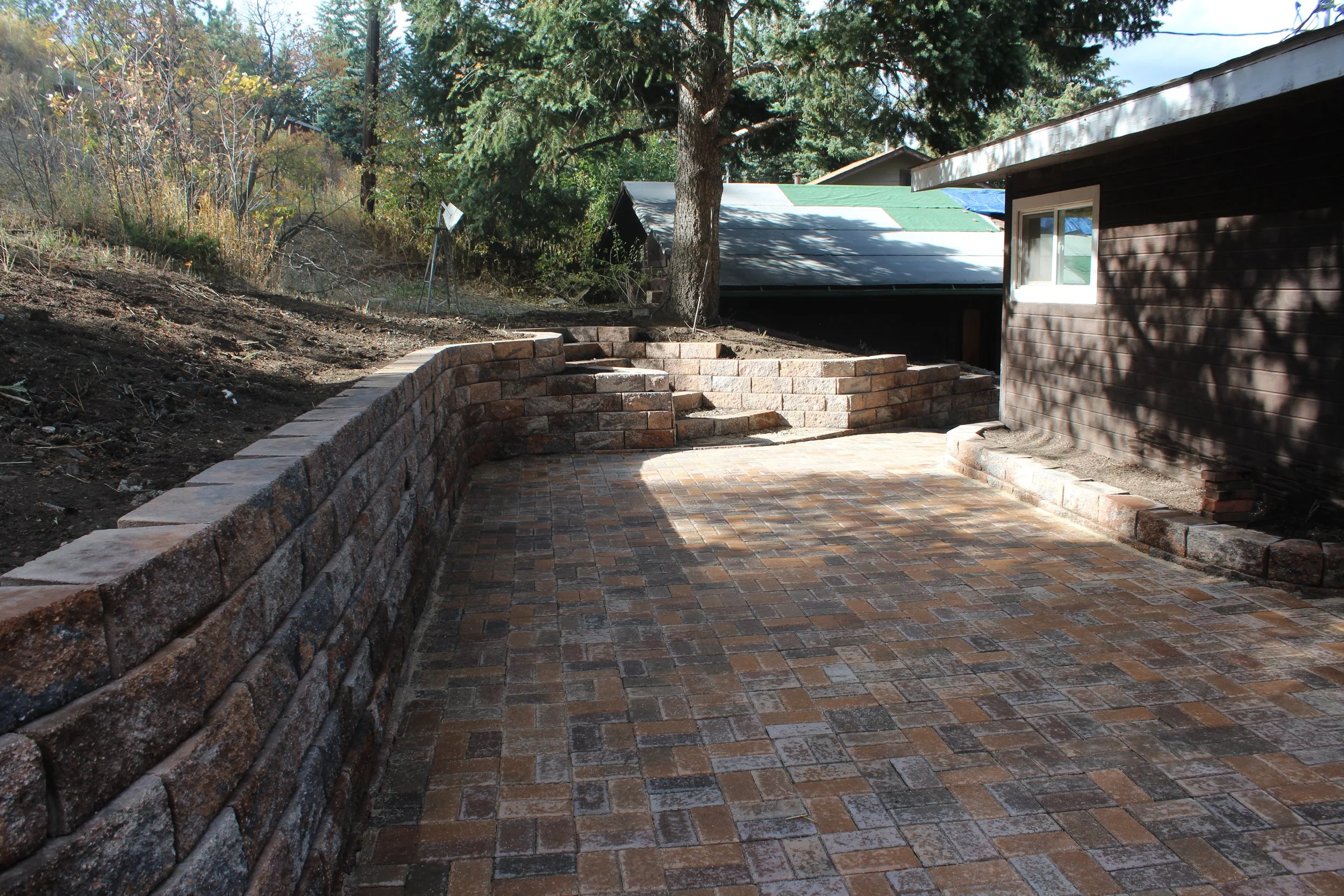 Shawnee retaining wall with stairway up into the yard