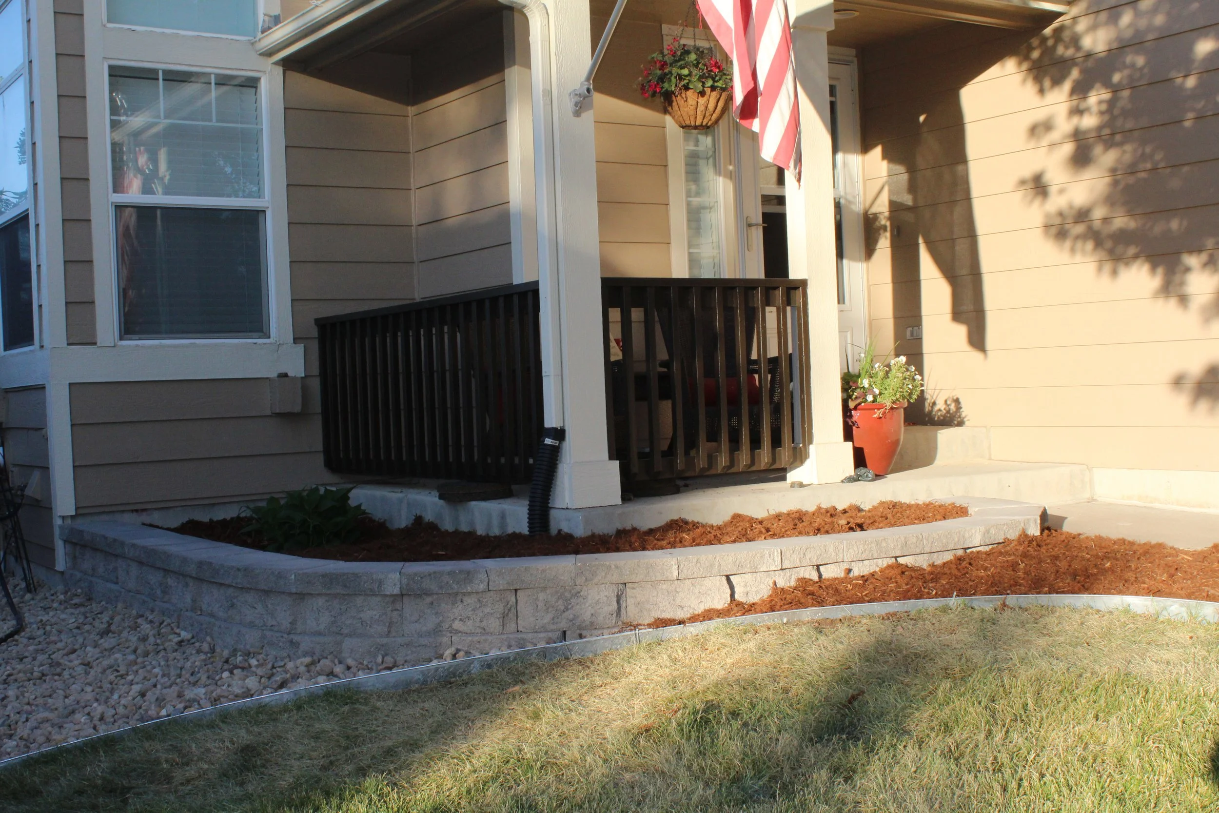 Retaining wall block and cap planter off front porch