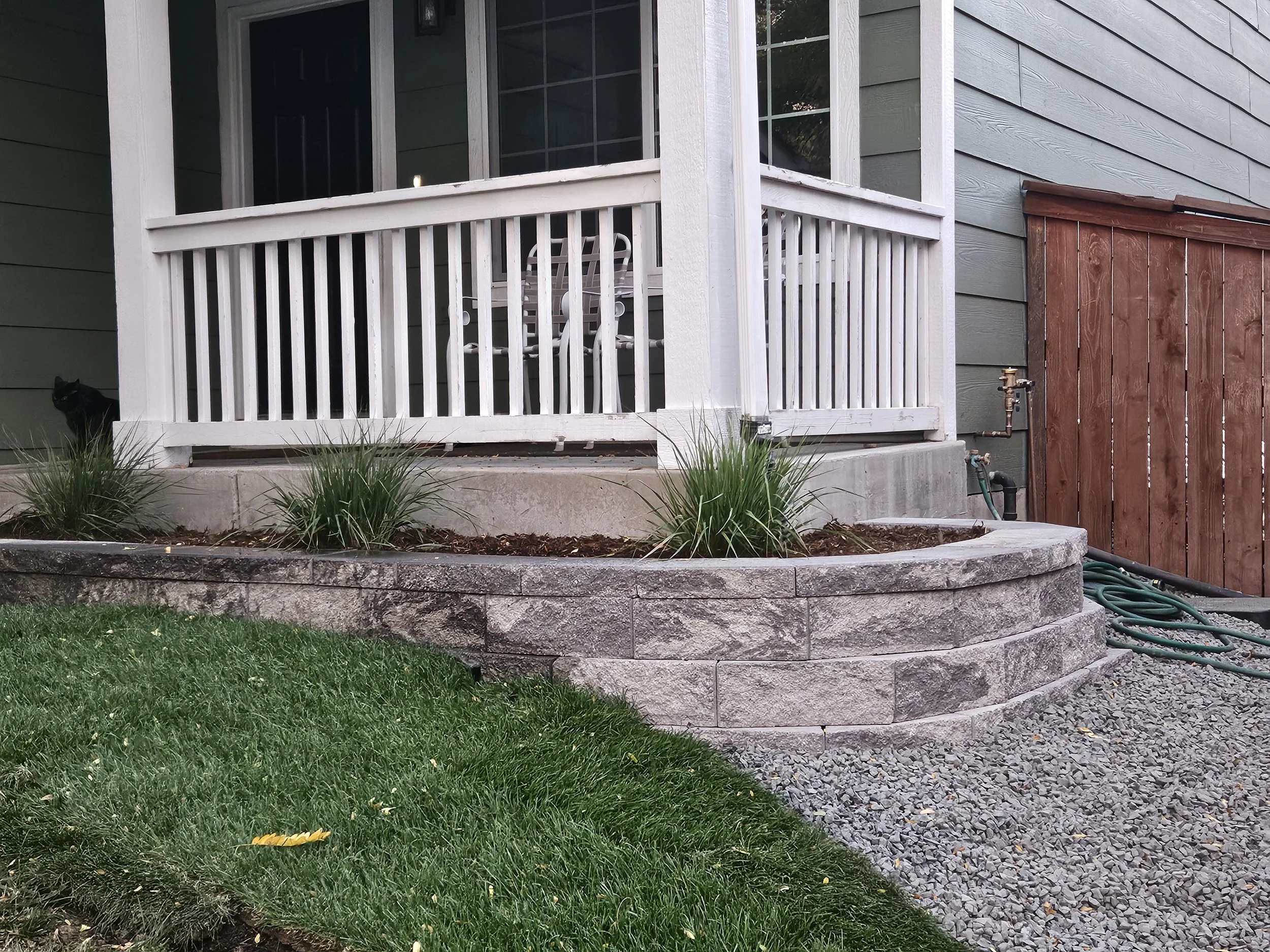 Retaining wall block and cap planter off front porch