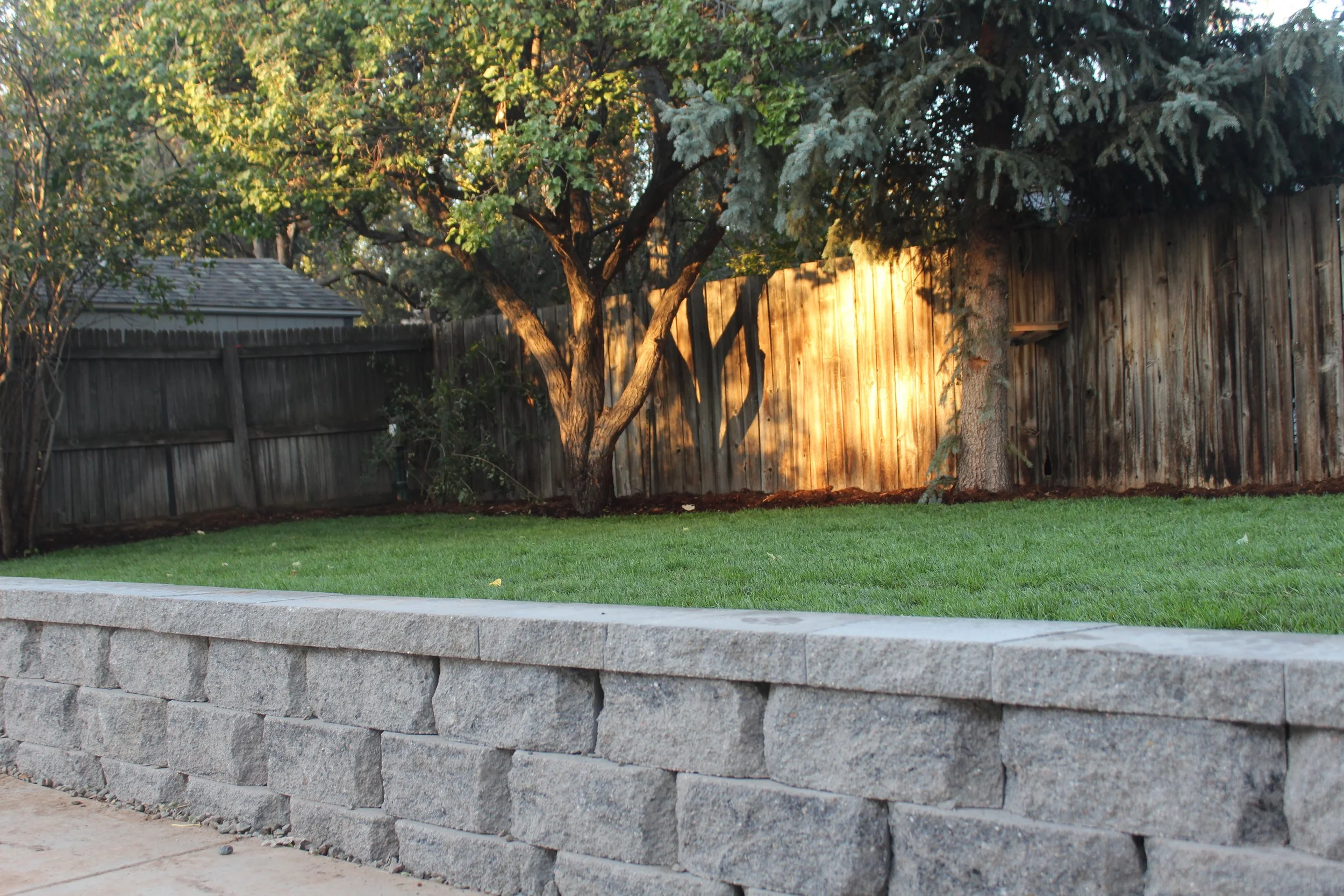 Littleton back yard retaining wall grey block with cap