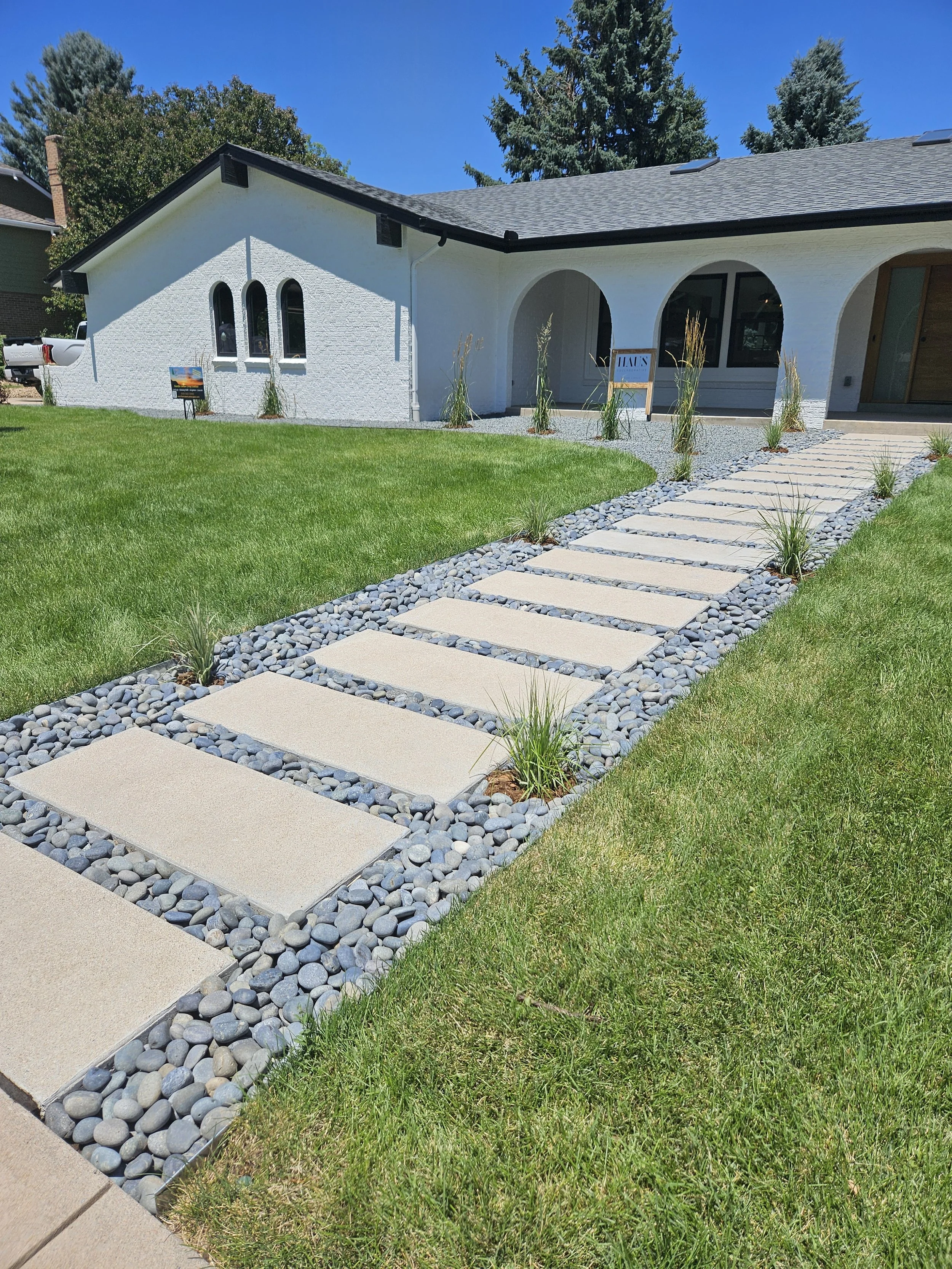 South Denver walkway curb appeal Mexican Beach pebble with concrete blocks sod and shrubs
