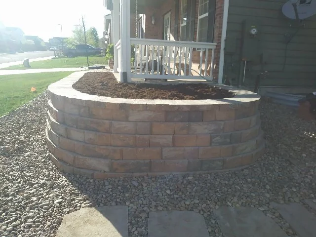Retaining wall block planter on front porch